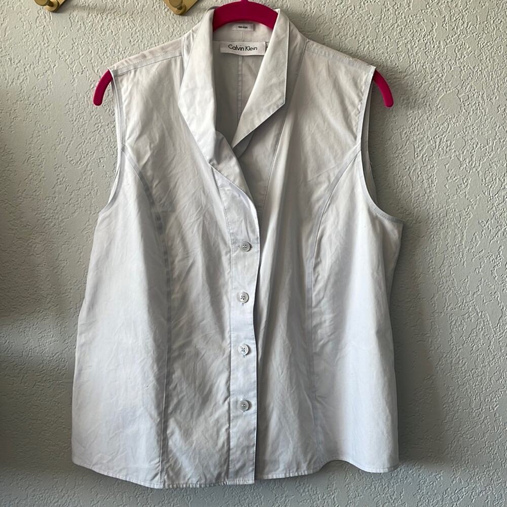 Sleeveless pale blue button front top